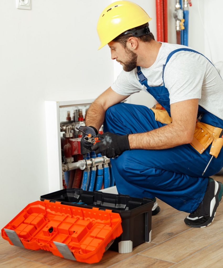 focused-technician-plumber-in-uniform-using-tools-2022-02-23-18-17-38-utc
